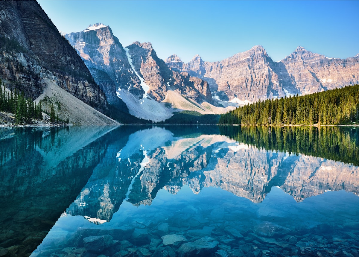 Moraine Lake surrounded by snow-capped Rocky Mountain peaks in Banff National Park, Canada