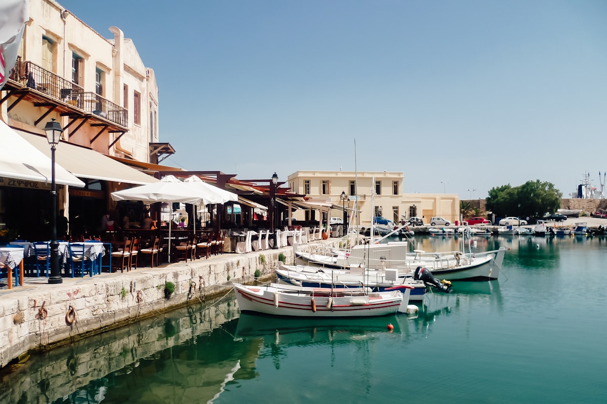 Rethymno old Venetian harbor with fishing boats and waterfront tavernas on the island of Crete