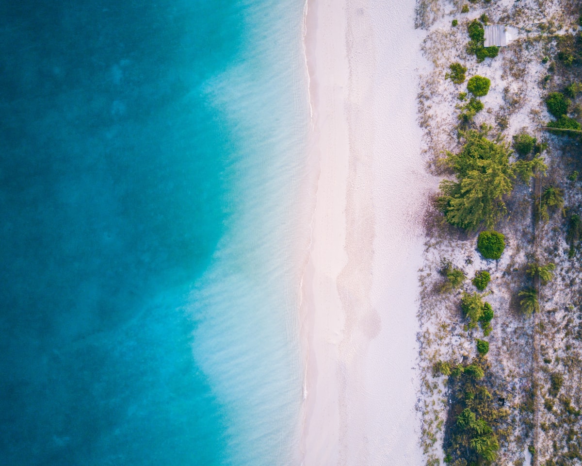 Crystal clear turquoise water meeting white sand at Grace Bay Beach in Turks and Caicos