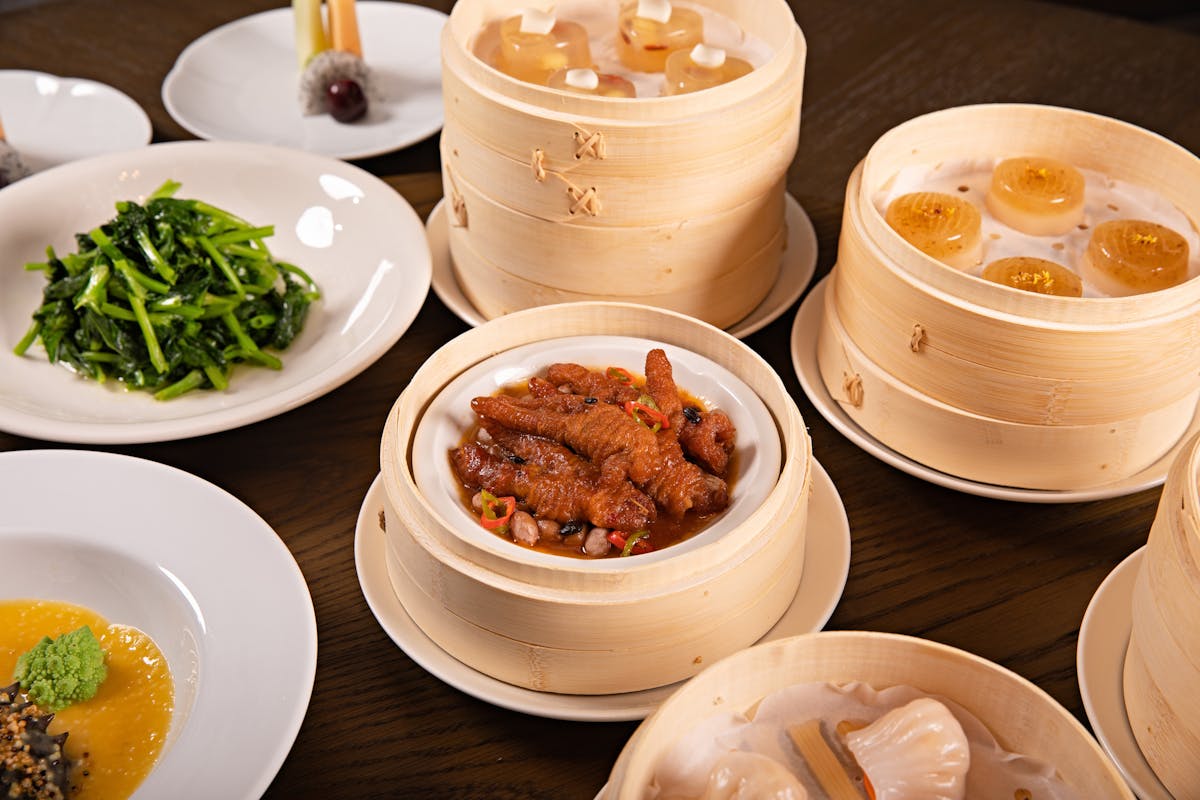 Bamboo steamer baskets filled with traditional Cantonese dim sum dumplings at a Guangzhou restaurant