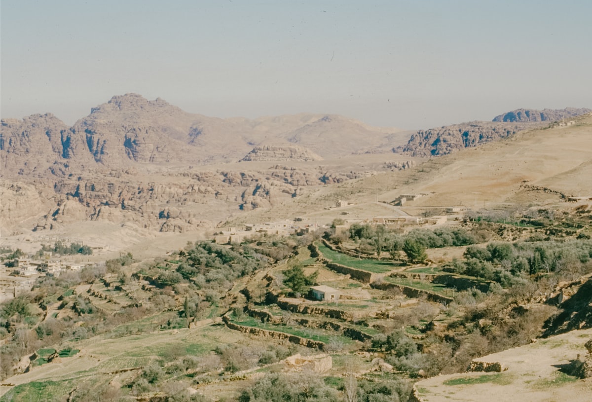Dramatic Middle Eastern landscape with barren hills and ancient pathways stretching across the terrain