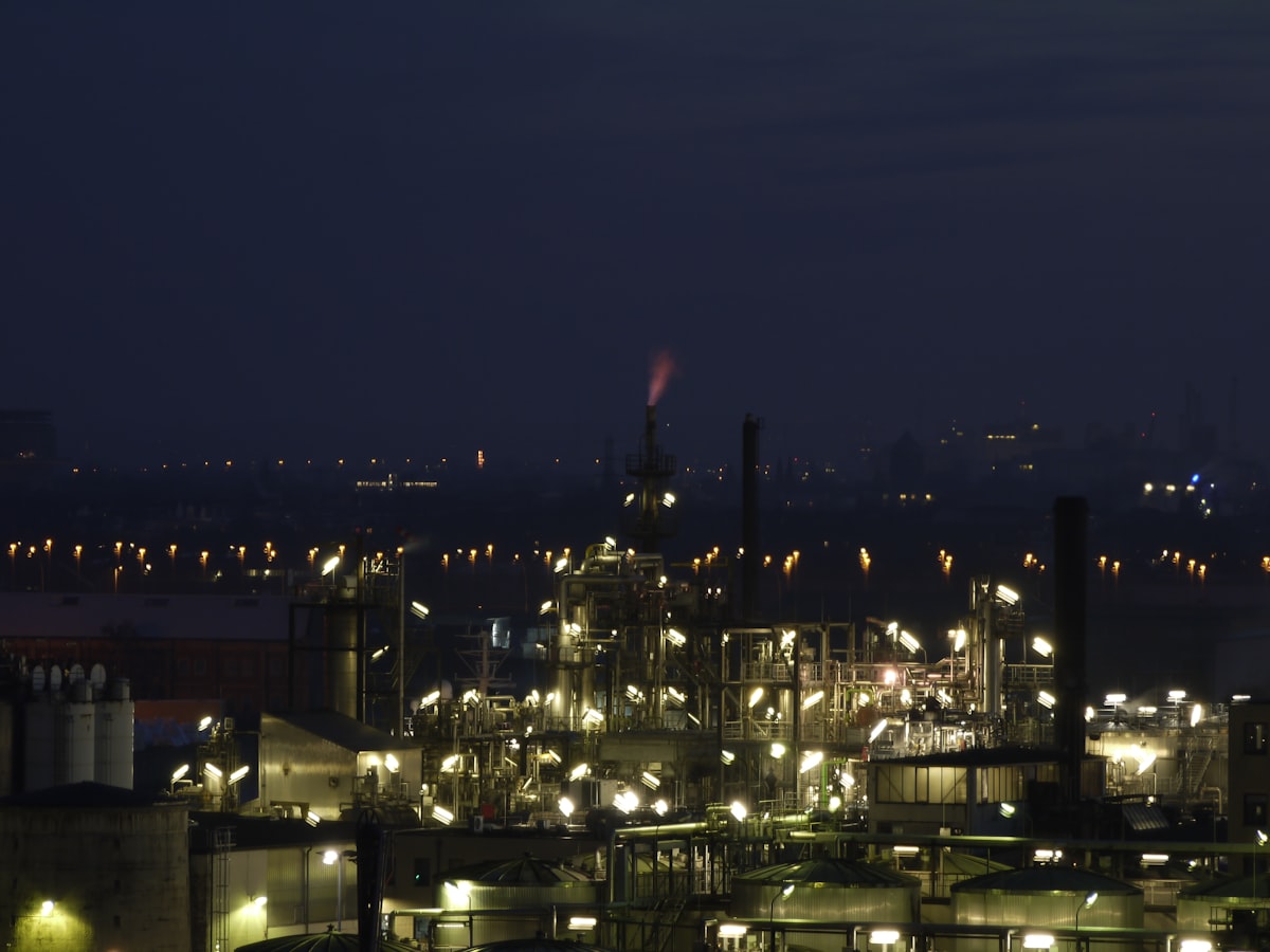 Oil refinery with industrial infrastructure against a sunset sky in the Arabian Gulf region