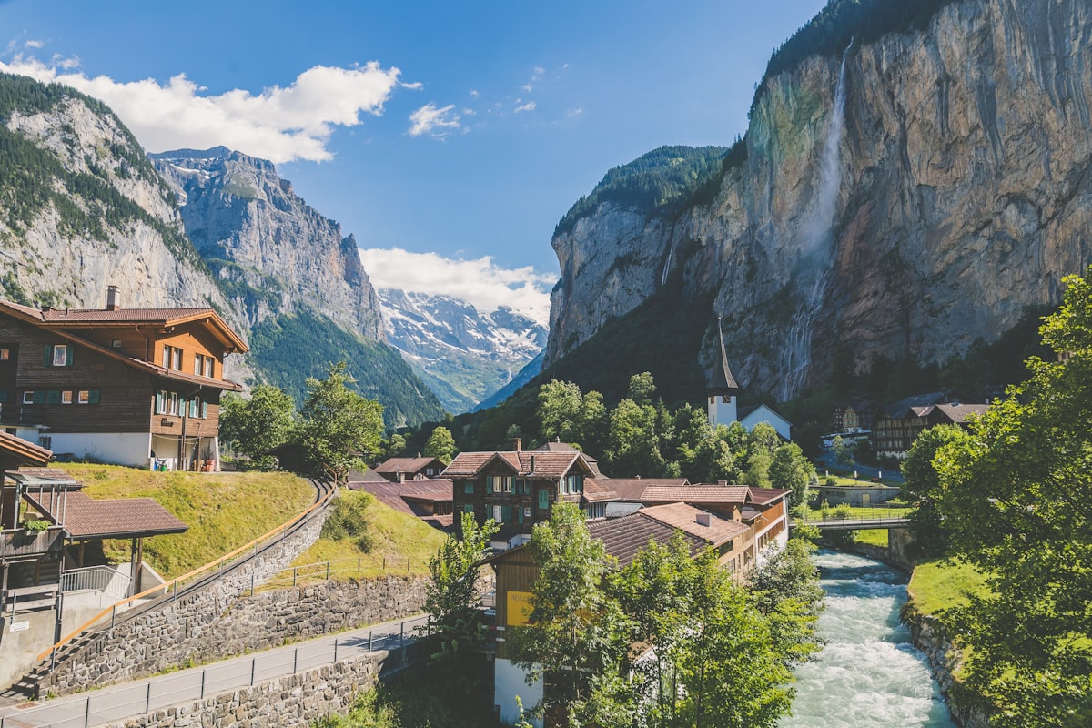 Alpine village of Lauterbrunnen nestled between dramatic cliff faces and waterfalls in Switzerland