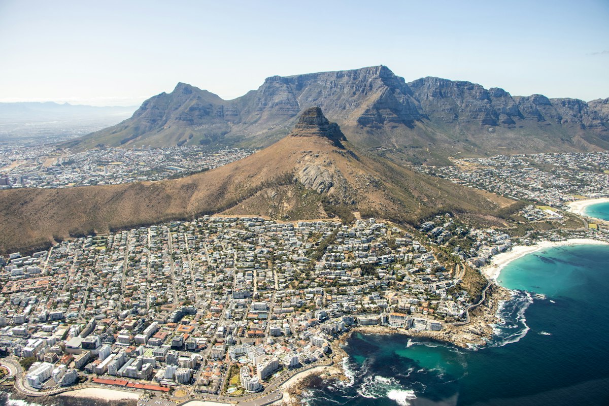 Aerial view of Cape Town's Atlantic coastline with Lion's Head rising above the city and beaches below