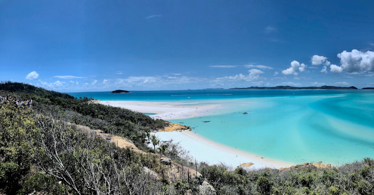 Swirling white silica sand and turquoise water at Whitehaven Beach in the Whitsunday Islands, Australia
